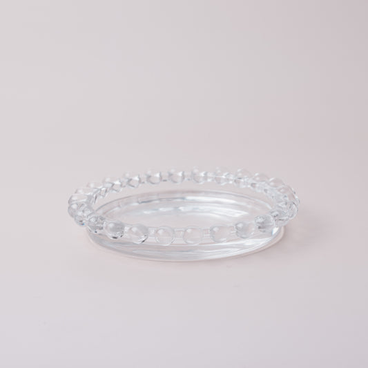 Clear glass candle holder decorated with glass beads
